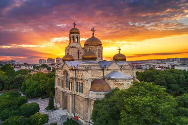 Colorful sunset over The Cathedral of the Assumption in Varna, aerial view